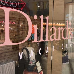 Cut vinyl letters that read "Dillard's Vacation" applied on window at Citadel Mall, Charleston