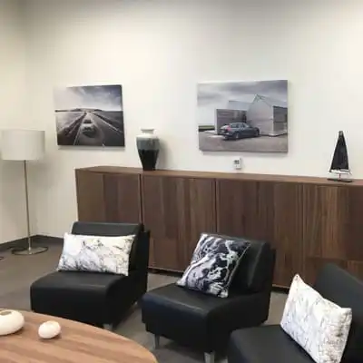 Two canvas prints displayed in an office space