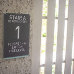 Acrylic ADA Stairwell Signage for East West Partners